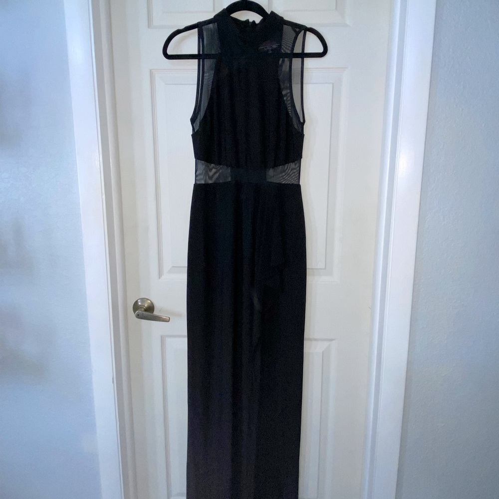 Beautiful black long dress. High leg slit. Mesh detail. High neck.